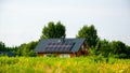 ecological wooden house with solar panels on a sunny day