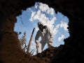 Ecologist digging pit by shovel and planting tree