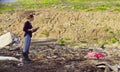 Ecologist during the research on garbage dump.