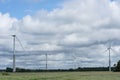 Ecology concept: Blue sky, white clouds and wind turbine. Wind generator for electricity, alternative energy source. Royalty Free Stock Photo