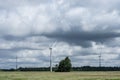 Ecology concept: Blue sky, white clouds and wind turbine. Wind generator for electricity, alternative energy source. Royalty Free Stock Photo