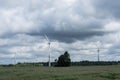 Ecology concept: Blue sky, white clouds and wind turbine. Wind generator for electricity, alternative energy source. Royalty Free Stock Photo