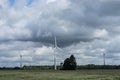 Ecology concept: Blue sky, white clouds and wind turbine. Wind generator for electricity, alternative energy source. Royalty Free Stock Photo