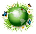 Ecology concept.Green Globe and Grass with Flowers.