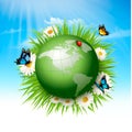 Ecology concept.Green Globe and Grass with Flowers.