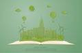 Ecology and environment conservation concept. Green city landscape on open book in paper cut style