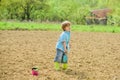 Ecology and environmental protection. small kid planting a flower. earth day. soils and fertilizers. summer farm Royalty Free Stock Photo