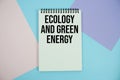Ecology And Green Energy text written on notepad flat lay on multicolor pastel background Royalty Free Stock Photo