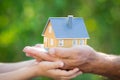 Ecology house in hands Royalty Free Stock Photo