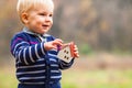 Ecology house in kid hands over nature background