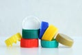 Ecology. Plastic multi-colored caps for bottles on a gray background. Royalty Free Stock Photo