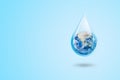 Ecology and Pollution Concept : Blue planet earth globe in water drop with blue background. Royalty Free Stock Photo