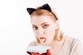 Ecology product and heath. Dieting and health. cat woman lick milk from plate. Food and drink. Cat woman eat sour Royalty Free Stock Photo