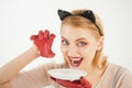 Ecology product and heath. Girl in kitten ears and red gloves with yoghurt isolated on white. Dieting and health. Cat Royalty Free Stock Photo