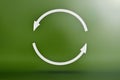 Ecology, recycling symbol, white arrows form a circle. 3D image on a green background. Green products, green renewable