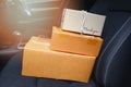 Ecommerce delivery parcels shopping online and order concept - shipping shopping online cardboard box on car seat Royalty Free Stock Photo