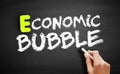 Economic Bubble text on blackboard, business concept background