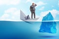 The economic crisis concept with businessman in sinking paper boat Royalty Free Stock Photo