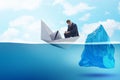 The economic crisis concept with businessman in sinking paper boat Royalty Free Stock Photo