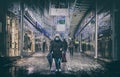 Economic crisis of 2020 , woman with mask walk on shopping mall during Covid-19 pandemic in christmas period Royalty Free Stock Photo