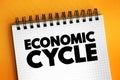 Economic Cycle - overall state of the economy as it goes through four stages in a cyclical pattern, text concept on notepad Royalty Free Stock Photo