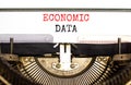 Economic data symbol. Concept words Economic data typed on white paper on old retro typewriter. Beautiful white background. Royalty Free Stock Photo