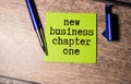 economic graphs and the inscription new business chapter one. Royalty Free Stock Photo