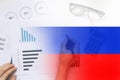 Economic report and histogram with statistics on the background of the Russian flag. Financial sanctions against Russia. The