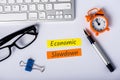 Economic slowdown - message at busninessman workplace. High unemployment and Economic stagnation Royalty Free Stock Photo