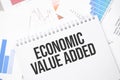 economic value added text on paper on the chart background with pen Royalty Free Stock Photo