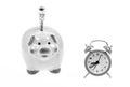 Economics and finance. It is time to pay. Piggy bank stuffed dollar cash and alarm clock. Financial crisis. Credit debt Royalty Free Stock Photo