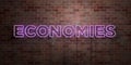 ECONOMIES - fluorescent Neon tube Sign on brickwork - Front view - 3D rendered royalty free stock picture