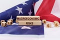 On the US flag and wooden plates with the inscription - macroeconomic risks