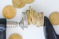 Economy pressure concept with stack of coins in a cramp Royalty Free Stock Photo