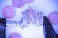 Economy pressure concept with stack of coins in a cramp Royalty Free Stock Photo