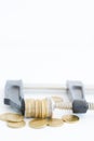 Economy pressure concept with stack of coins in a cramp Royalty Free Stock Photo