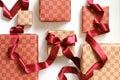 Ecru and red patterned Gift boxes with red ribbon Royalty Free Stock Photo