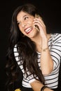 Ecstatic beautiful woman talking on her cell phone smiling