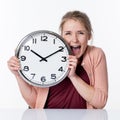 Ecstatic beautiful young blond woman holding a clock Royalty Free Stock Photo