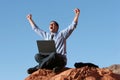 Ecstatic businessman working on laptop Royalty Free Stock Photo