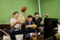 Ecstatic family, father and sons cheering for touchdown