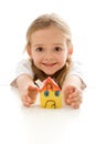 Ecstatic little girl with her clay house Royalty Free Stock Photo