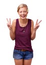 Ecstatic about peace. Studio shot of an attractive young woman laughing and giving the peace sign isolated on white. Royalty Free Stock Photo