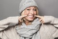 Ecstatic 20s winter girl expressing joy with fake smile Royalty Free Stock Photo