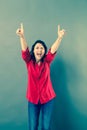 Ecstatic woman laughing with extrovert hand gesture