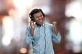 Ecstatic young man enjoying listening to music with headphones. Royalty Free Stock Photo