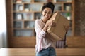 Ecstatic young woman embracing box with something inside Royalty Free Stock Photo