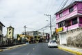 Ecuador town with a road and parked vehicles Royalty Free Stock Photo