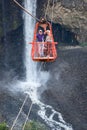 Senior tourists gliding on the zip line trip in Cascades route, Banos Royalty Free Stock Photo