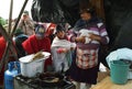 Ecuadorian ethnic people with indigenous clothes having breakfast in a rural Saturday market in Zumbahua village, Ecuador.